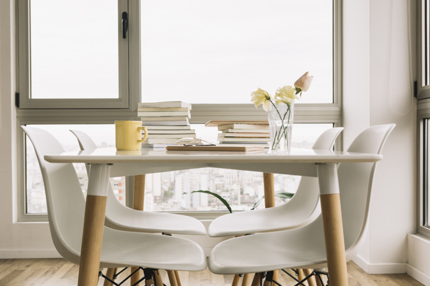 chairs-near-table-with-books-decorations